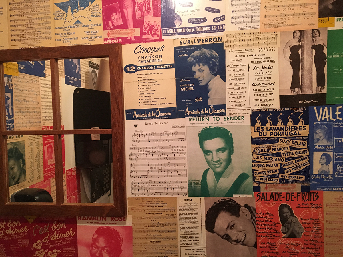 Washrooms wallpapered with actual old sheet music.